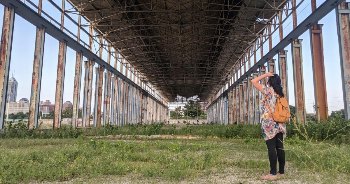 2024 Herron Distinguished Alumni Award Winner Jordan Ryan doing field work at an abandoned GM stamping plant
